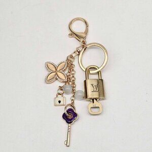 Authentic Louis Vuitton Lock & Key with unbranded Clover Flower Bag Charm 100525